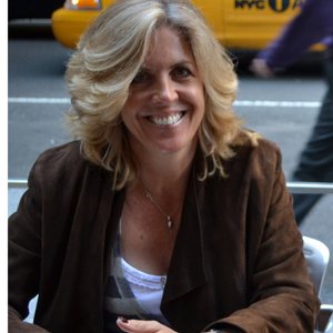 Vicky Finding, smiling, photographed outdoors on a city street